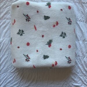 Rise Little Earthling White Throw with Red Festive Accents